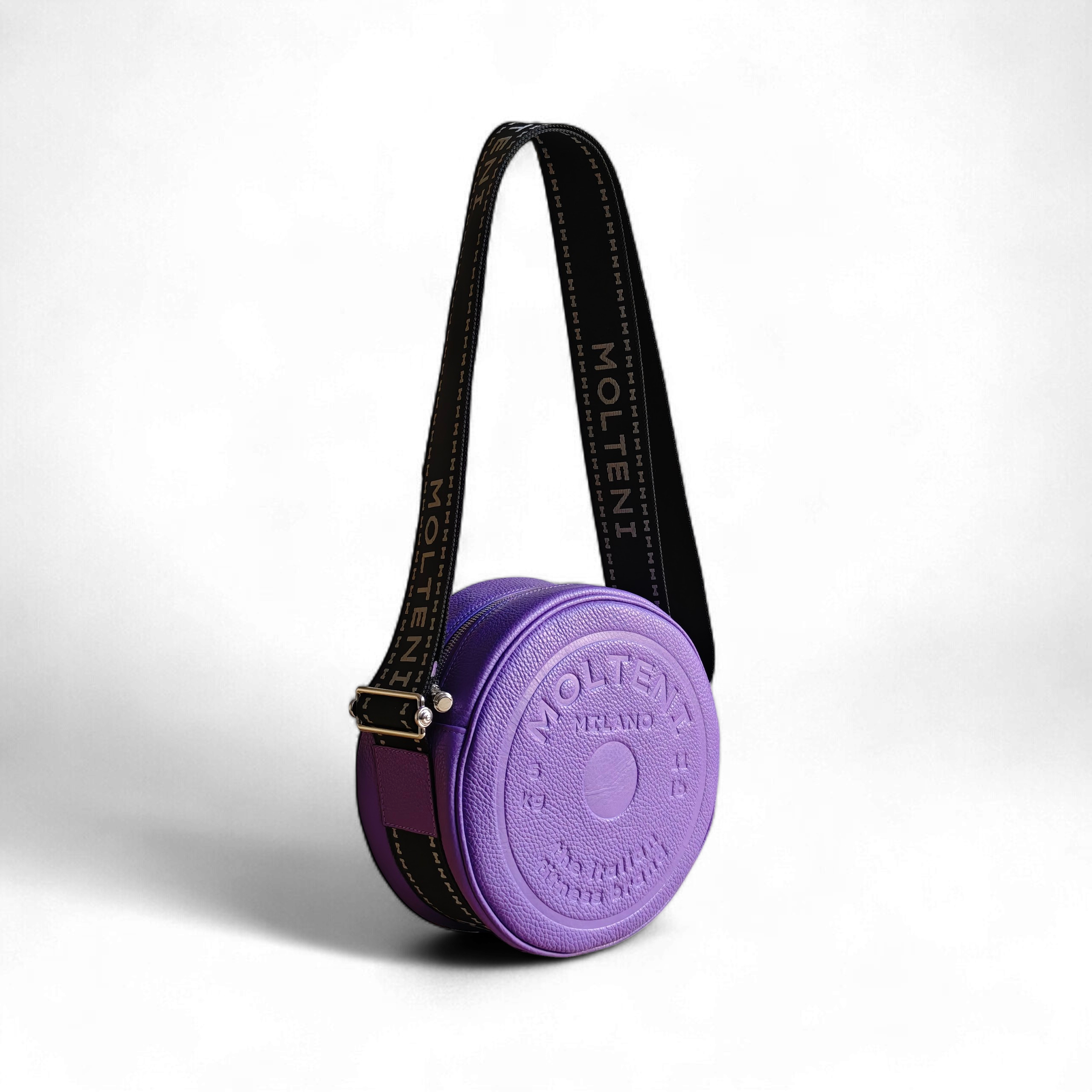 Borsa in pelle ELEO Medium purple Molteni Milano vista tre quarti, design ispirato al disco peso fitness, elegante e strutturata